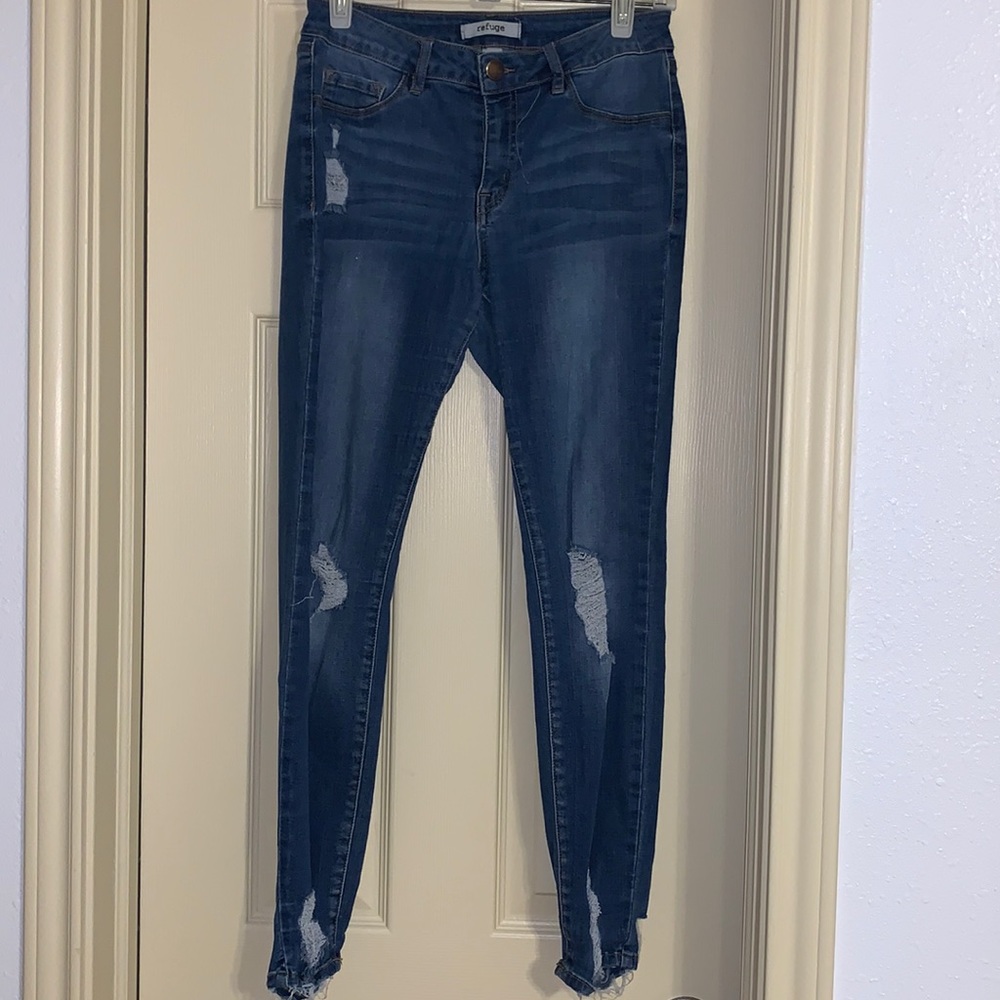 Light wash blue jeans, distressed jeans